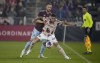 Portland Timbers midfielder Marvin Loría, front, fends off Colorado Rapids defender Danny Wilson during the first half of an MLS soccer match Tuesday, July 4, 2023, in Commerce City, Colo. (AP Photo/David Zalubowski)