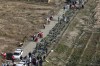 FILE - Bodies of the victims of a Ukrainian plane crash are collected by rescue team at the scene of the crash in Shahedshahr, southwest of the capital Tehran, Iran, Wednesday, Jan. 8, 2020. The United Kingdom, Canada, Sweden and Ukraine launched a case against Iran at the United Nations' highest court Wednesday, July 5, 2023, over the downing in 2020 of a Ukrainian passenger jet and the deaths of all 176 passengers and crew. (AP Photo/Ebrahim Noroozi, File)