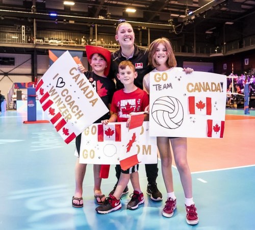 Canada volleyball coach Shannon Winzer poses with her children during the FIVB Volleyball Nations League as Canada takes on Serbia at the Seven Chiefs Sportsplex in Calgary on July 1, 2022. THE CANADIAN PRESS/HO-Volleyball Canada-Dave Holland **MANDATORY CREDIT**