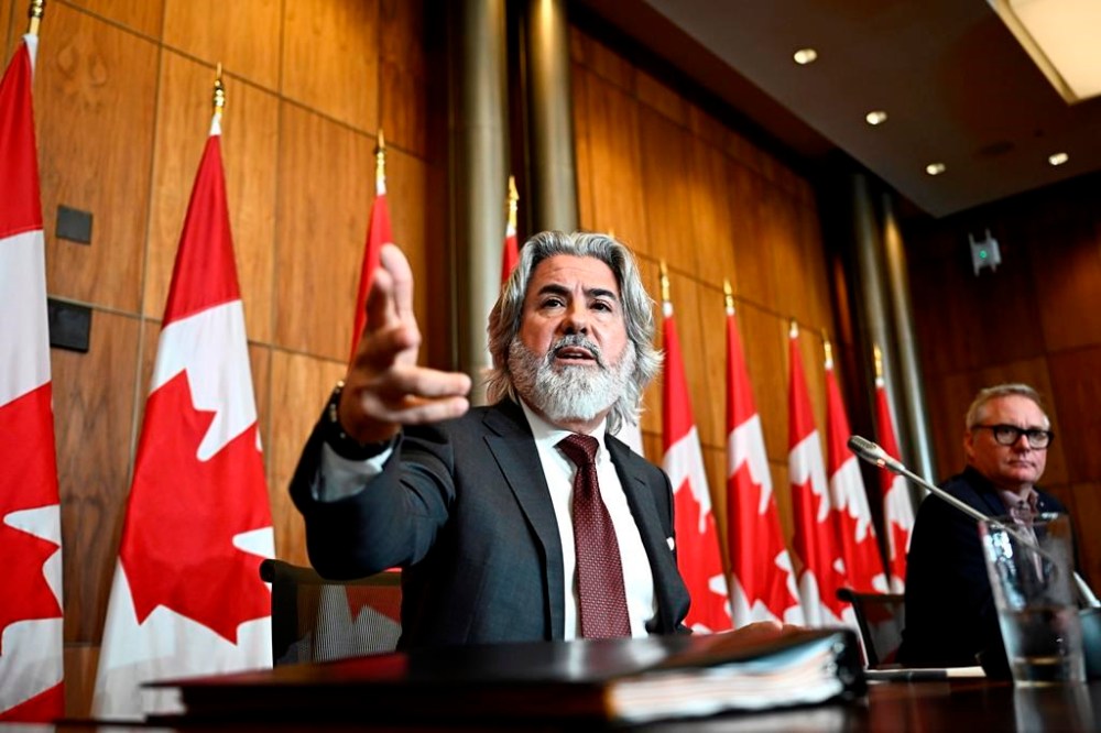 Minister of Canadian Heritage Pablo Rodriguez speaks during a news conference on Bill C-18, the Online News Act, along Bloc MP Martin Champoux, right, in Ottawa, on Wednesday, July 5, 2023. Tensions between Ottawa and tech giants further escalated on Wednesday over Canada's recently passed Online News Act. THE CANADIAN PRESS/Justin Tang