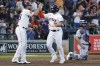 Houston Astros' Jose Abreu, left, and Yainer Diaz, center, celebrate at the plate behind Colorado Rockies catcher Elias Diaz, right, after a two run home run by Diaz during the fourth inning of a baseball game Wednesday, July 5, 2023, in Houston. (AP Photo/Michael Wyke)