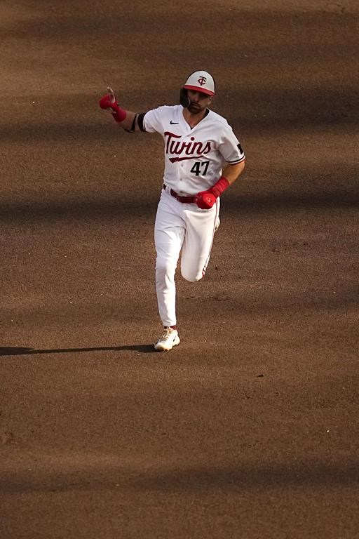 Minnesota Twins' Edouard Julien runs the bases after hitting a solo home run against the Kansas City Royals during the first inning of a baseball game Wednesday, July 5, 2023, in Minneapolis. (AP Photo/Abbie Parr)