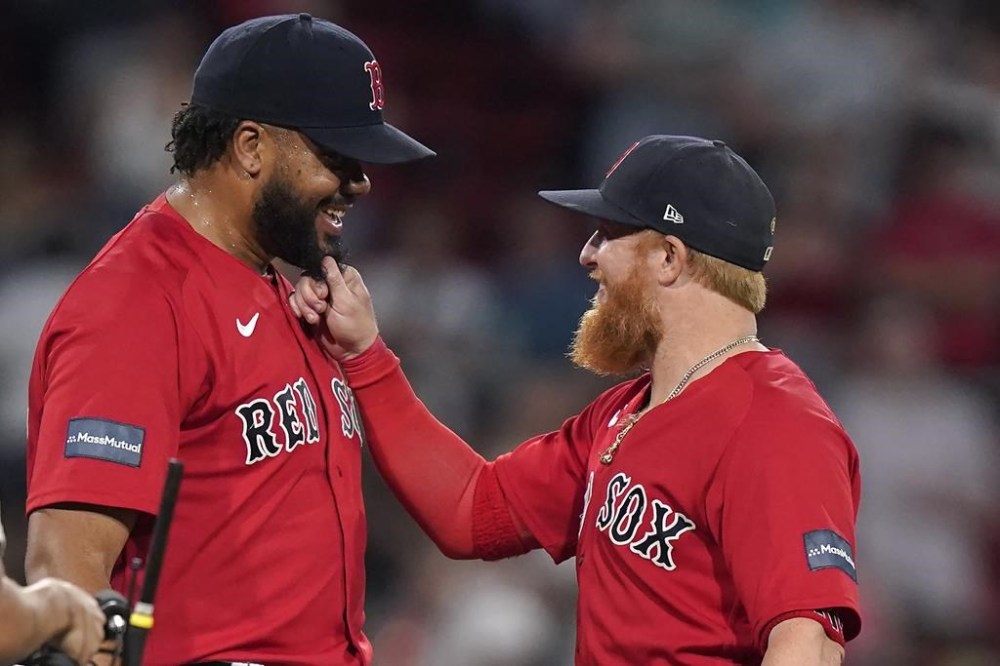 Boston Red Sox's Kenley Jansen, left, celebrates with Justin Turner, right, after the Red Sox beat the Texas Rangers in a baseball game, Wednesday, July 5, 2023, in Boston. (AP Photo/Steven Senne)