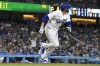 Los Angeles Dodgers' J.D. Martinez heads to first after hitting a three-run home run during the fifth inning of a baseball game against the Pittsburgh Pirates Wednesday, July 5, 2023, in Los Angeles. (AP Photo/Mark J. Terrill)
