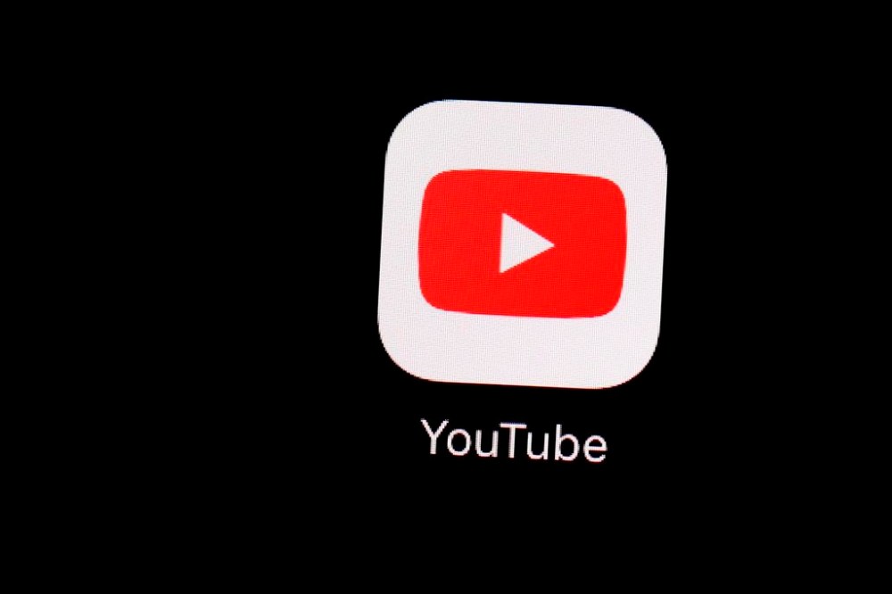 This March 20, 2018, file photo shows the YouTube app on an iPad in Baltimore. Quebec police say they have arrested a social media influencer who allegedly committed fake crimes in an effort to gain popularity. THE CANADIAN PRESS/AP-Patrick Semansky