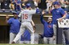 Chicago Cubs' Yan Gomes is congratulated after hitting a two-run home run during the eighth inning of a baseball game against the Milwaukee Brewers Thursday, July 6, 2023, in Milwaukee. (AP Photo/Morry Gash)