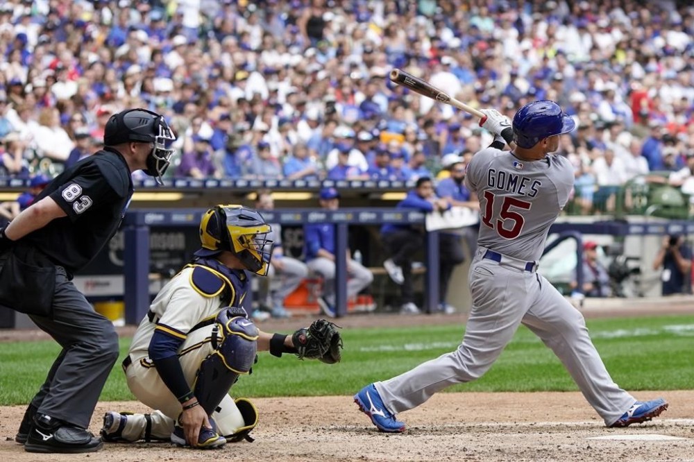 Chicago Cubs' Yan Gomes hits a two-run home run during the eighth inning of a baseball game against the Milwaukee Brewers Thursday, July 6, 2023, in Milwaukee. (AP Photo/Morry Gash)