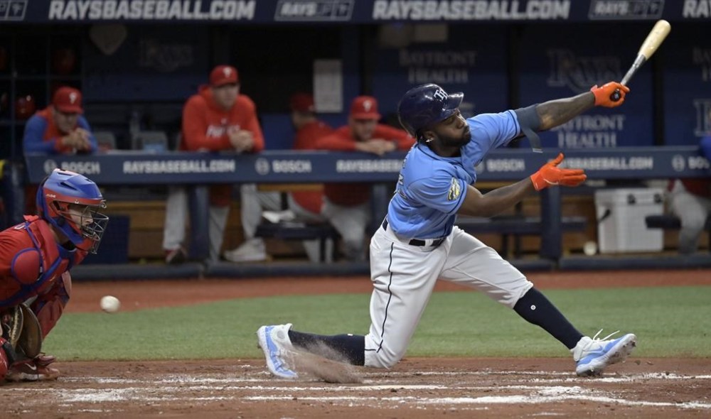 Philadelphia Phillies catcher Garrett Stubbs, left, blocks a pitch in the dirt as Tampa Bay Rays' Randy Arozarena, right, strikes out to end the fourth inning of a baseball game Thursday, July 6, 2023, in St. Petersburg, Fla. (AP Photo/Steve Nesius)