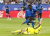 CF Montreal forward Sunusi Ibrahim (14) is stopped by Nashville SC defender Josh Bauer (22) during second half MLS soccer action on Wednesday, June 21, 2023 in Montreal. CF Montreal looks to rekindle its dominance at home as it continues its playoff push Saturday against Atlanta United. THE CANADIAN PRESS/Christinne Muschi