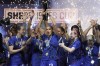 FILE - United States forward Alex Morgan, center, lifts the SheBelieves Cup with teammates after they won a soccer match against Brazil 2-0 Wednesday, Feb. 22, 2023, in Frisco, Texas. (AP Photo/LM Otero, File)