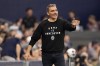 Vancouver Whitecaps head coach Vanni Sartini talks to his players during the first half of an MLS soccer match against Sporting Kansas City Saturday, July 1, 2023, in Kansas City, Kan. The Vancouver Whitecaps are hoping home comforts once again provide relief after a loss on the road. 
