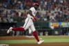 Texas Rangers' Adolis Garcia jogs around the bases after hitting a solo home run in the bottom of the seventh inning in a baseball game against the Houston Astros in Arlington, Texas, Monday, July 3, 2023. (AP Photo/Emil T. Lippe)