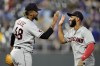 Cleveland Guardians relief pitcher Emmanuel Clase (48) and Amed Rosario celebrate after their baseball game against the Kansas City Royals Tuesday, June 27, 2023, in Kansas City, Mo. The Guardians won 2-1. (AP Photo/Charlie Riedel)