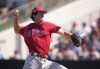 FILE - Philadelphia Phillies' pitcher Andrew Painter delivers to a Minnesota Twins batter during a spring training baseball game March 1, 2023, in Fort Myers, Fla. Painter is undergoing testing because of discomfort in his right elbow, manager Rob Thomson said Friday, July 7. Thomson did not say what type of testing Painter will have but said the 19-year-old right-hander starting feeling discomfort after a bullpen session Thursday. Painter sprained the ulnar collateral ligament in his throwing elbow during spring training. (AP Photo/Brynn Anderson, File)