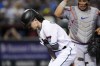 Arizona Diamondbacks' Corbin Carroll, left, holds his shoulder after an injury during a swing attempt, as New York Mets catcher Francisco Alvarez watches during the seventh inning of a baseball game Thursday, July 6, 2023, in Phoenix. (AP Photo/Ross D. Franklin)