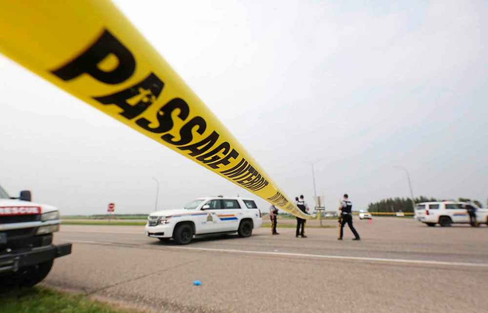 Police tape at the scene of a deadly collision between a semi truck and a small bus carrying seniors at the corner of Highway 5 and the Trans-Canada Highway near Carberry, Man. on June 15, 2023. (Matt Goerzen / The Brandon Sun)