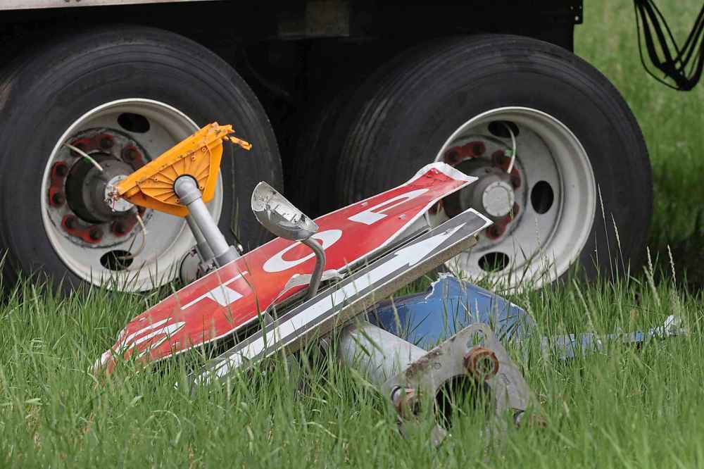 A stop sign lies at the ground at the scene of the deadly collision. (Matt Goerzen / The Brandon Sun)