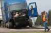 An emergency worker walks passed a semi truck that was involved in a deadly collision Thursday with a small bus carrying seniors at the corner of Highway 5 and the Trans-Canada Highway. The semi had the right of way, police say. (Matt Goerzen/The Brandon Sun)