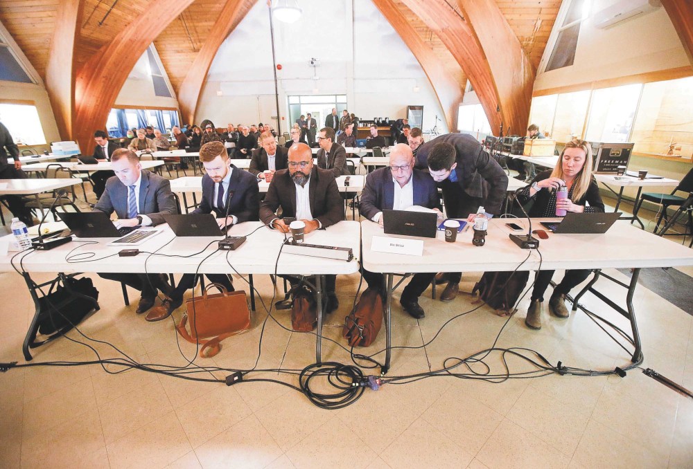 JOHN WOODS / WINNIPEG FREE PRESS FILES
Feisal Somji, president and CEO of Sio Silica, centre, and Brent Bullen, Sio’s chief operating officer and director, centre right, attend a Clean Environment Commission hearing in Steinbach in March.