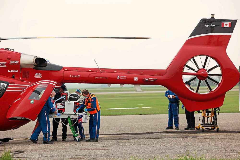A critical care team loads a victim of the Trans Canada Highway mass casualty collision at Carberry into a STARS Air Ambulance for transport to the Health Sciences Centre in Winnipeg. (Tim Smith / The Brandon Sun)
