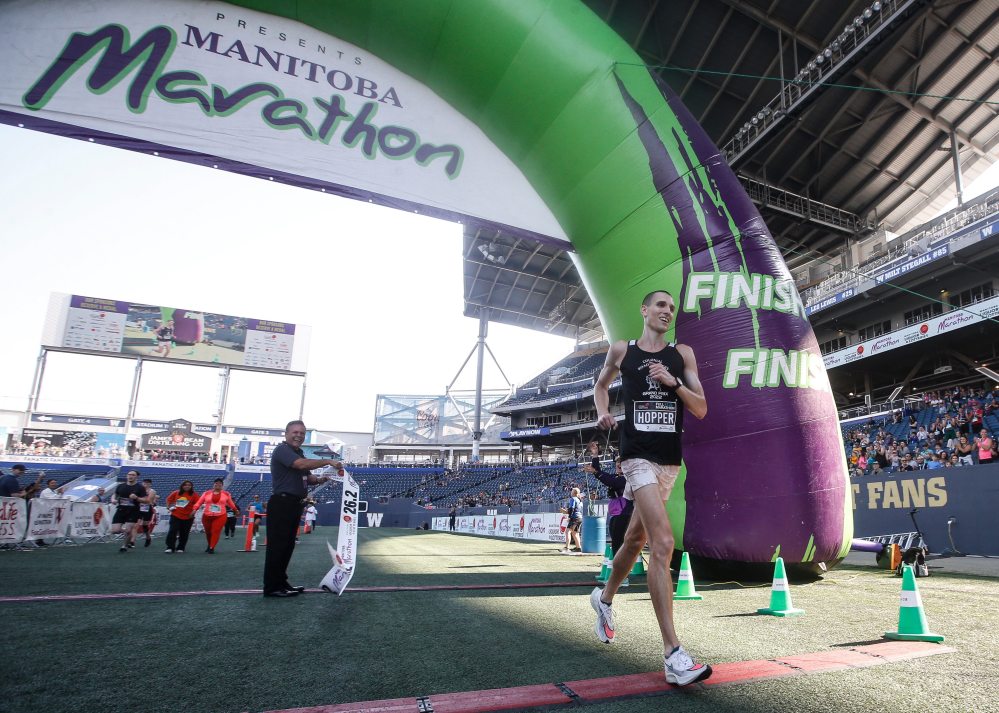 JOHN WOODS / WINNIPEG FREE PRESS
Roger Hopper crosses the line to finish first in the 45th Manitoba Marathon in Winnipeg, Sunday, June 18, 2023.