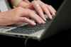 A person types on a laptop computer THE CANADIAN PRESS/Sean Kilpatrick