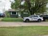 An RCMP vehicle is shown parked at the scene of a brutal home invasion that happened in Erickson on Tuesday. Despite her extensive injuries, the woman who was attacked fled the home and was helped by her neighbour across the street. (Submitted)