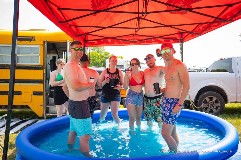 <p>DAUPHIN’S COUNTRYFEST</p>
                                <p>Campers beat the heat at Countryfest, where temperatures reached 30 C.</p>