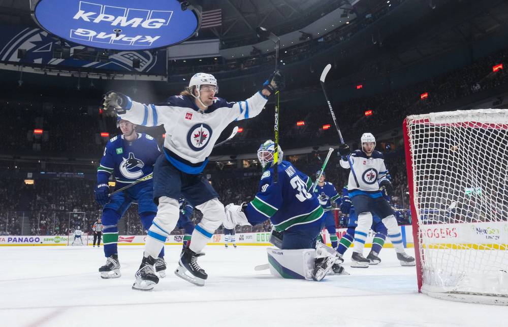 DARRYL DYCK / THE CANADIAN PRESS FILES
Axel Jonsson-Fjallby (left) had six goals and eight assists for the Jets last season.