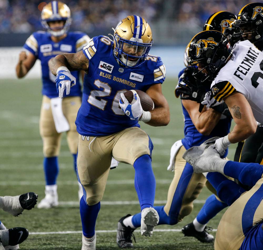 JOHN WOODS / THE CANADIAN PRESS FILES
Winnipeg Blue Bombers’ Brady Oliveira has 327 yards along the ground on 62 touches for a 5.3 yards per carry average.