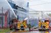 MIKE DEAL / WINNIPEG FREE PRESS
                                WFPS crews try to douse a large fire in the block on the southwest corner of Sutherland Avenue and Maple Street North Tuesday morning.