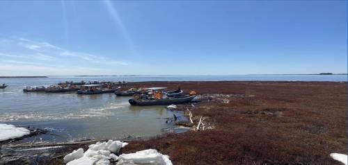 Supplied
boats trying to remove the massive peat island