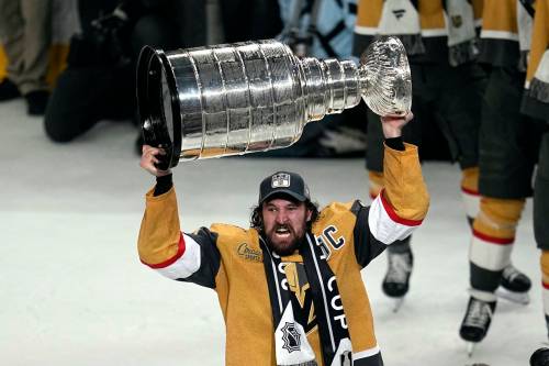 Teammates spray Vegas Golden Knights captain Mark Stone, who held the same job with the Brandon Wheat Kings, as he holds the Stanley Cup during a rally after a parade along the Las Vegas Strip for the NHL hockey champions on Saturday in Las Vegas. (Associated Press)
                                Vegas Golden Knights right wing Mark Stone skates with the Stanley Cup. (Abbie Parr / The Associated Press files)