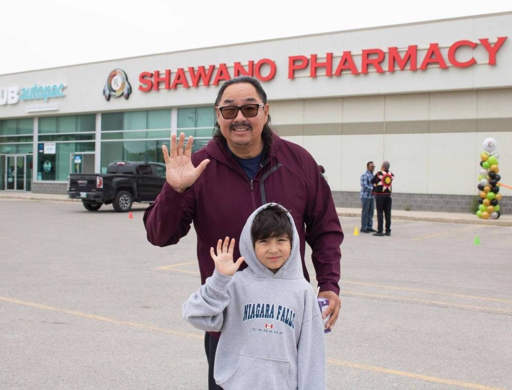 MIKE THIESSEN / WINNIPEG FREE PRESS
                                Black River First Nation Chief Sheldon Kent with his grandson at the grand opening of Shawano Pharmacy’s new location on McPhillips Street.