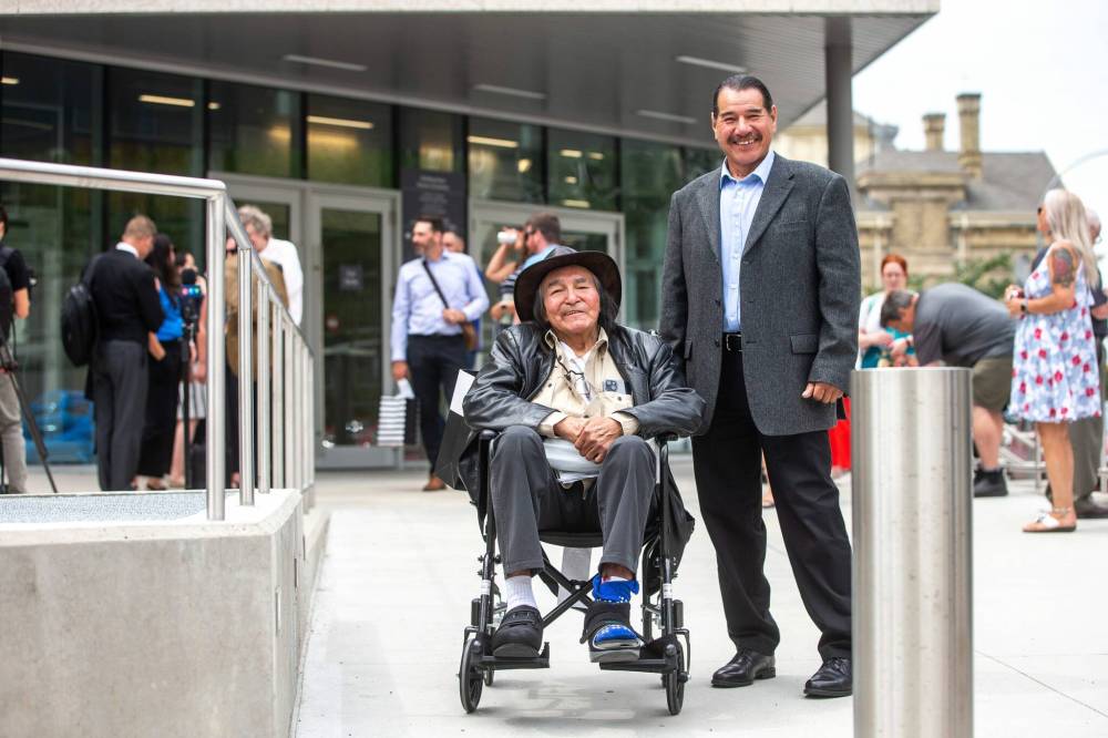 MIKAELA MACKENZIE / WINNIPEG FREE PRESS
Allan Woodhouse (left) and Brian Anderson outside the Law Courts as innocent men after being wrongfully convicted of murder decades ago on Tuesday.