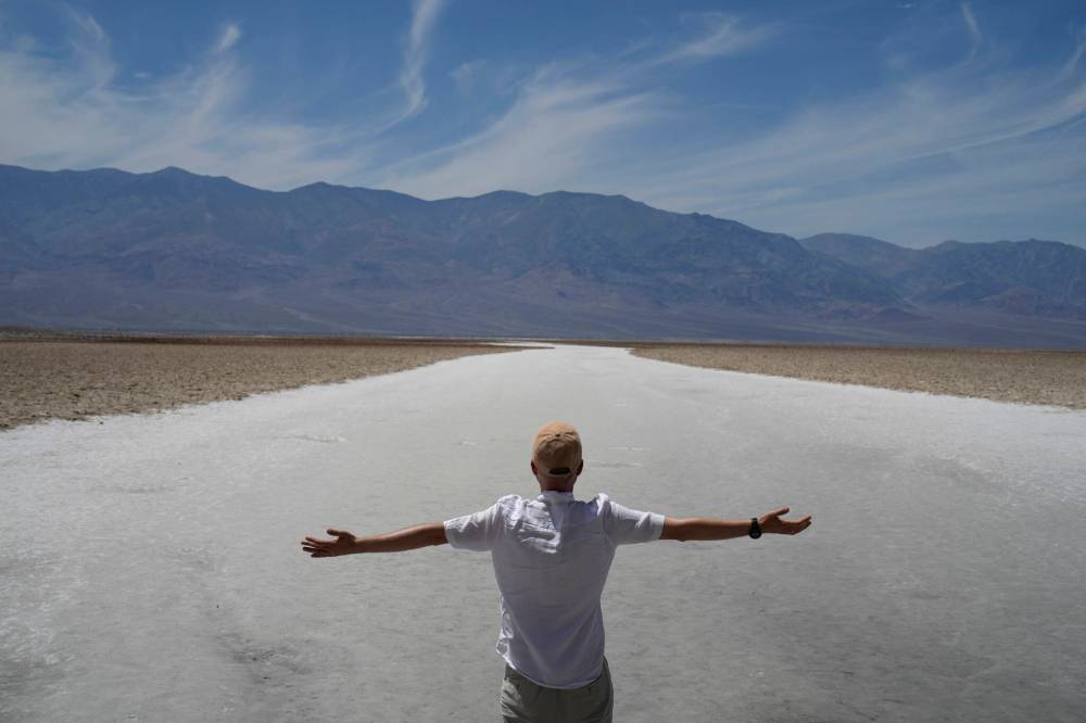 John Locher / AP Files
A person stands on the salt flats at Badwater Basin July 16 in Death Valley National Park, Calif. Death Valley’s brutal temperatures come amid a blistering stretch of hot weather that has put roughly one-third of Americans under some type of heat advisory, watch or warning.