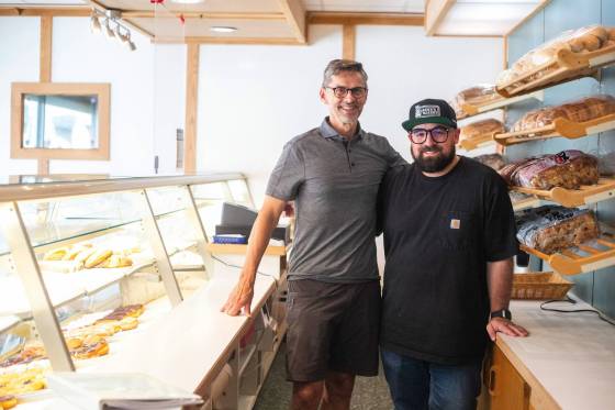 Russ Meier (left), former owner of the Donut House on Selkirk Avenue, and Jon Hochman, who acquired Gunn's Bakery in 2019. (Mikaela MacKenzie / Winnipeg Free Press)