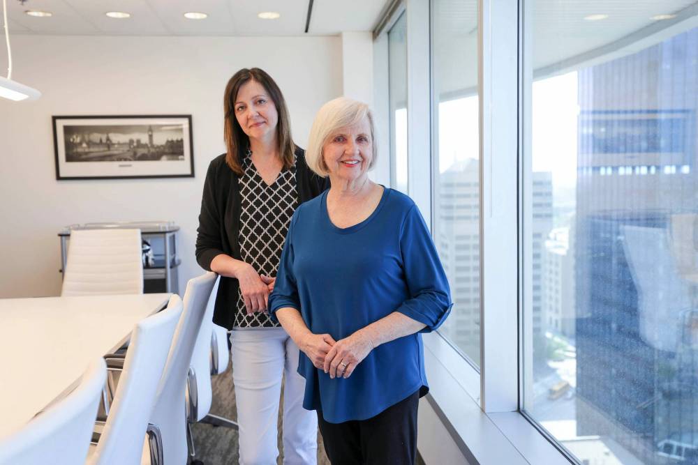 Joy Smith and her daughter Janet Campbell, CEO and president of the foundation bearing her mother's name, in the organization's Portage Avenue office. Smith and the foundation, which fights human trafficking and raises awareness of the practice, have set their sights on establishing an education centre and residence for survivors in Winnipeg. (Ruth Bonneville / Winnipeg Free Press)