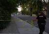 JESSICA LEE / WINNIPEG FREE PRESS A police officer sets up tape again after a forensics truck entered a crime scene at Mountain Ave. and Salter St. on June 17, 2022 after a police officer shot a person there earlier in the day.