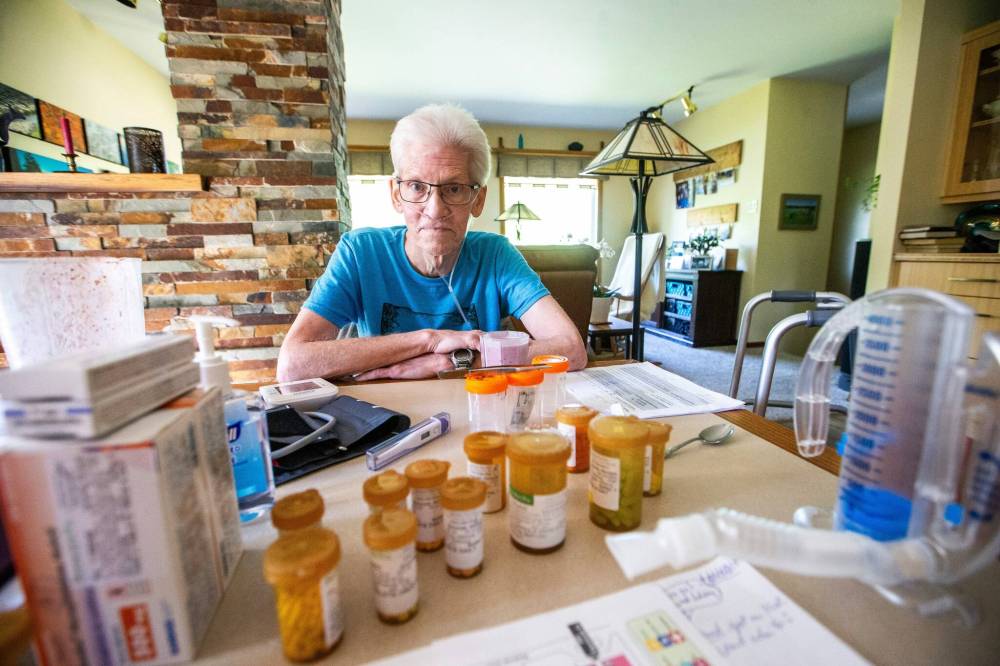 MIKAELA MACKENZIE / WINNIPEG FREE PRESS
Rick Schmidt with the numerous medications he needs as he recovers from a lung transplant.