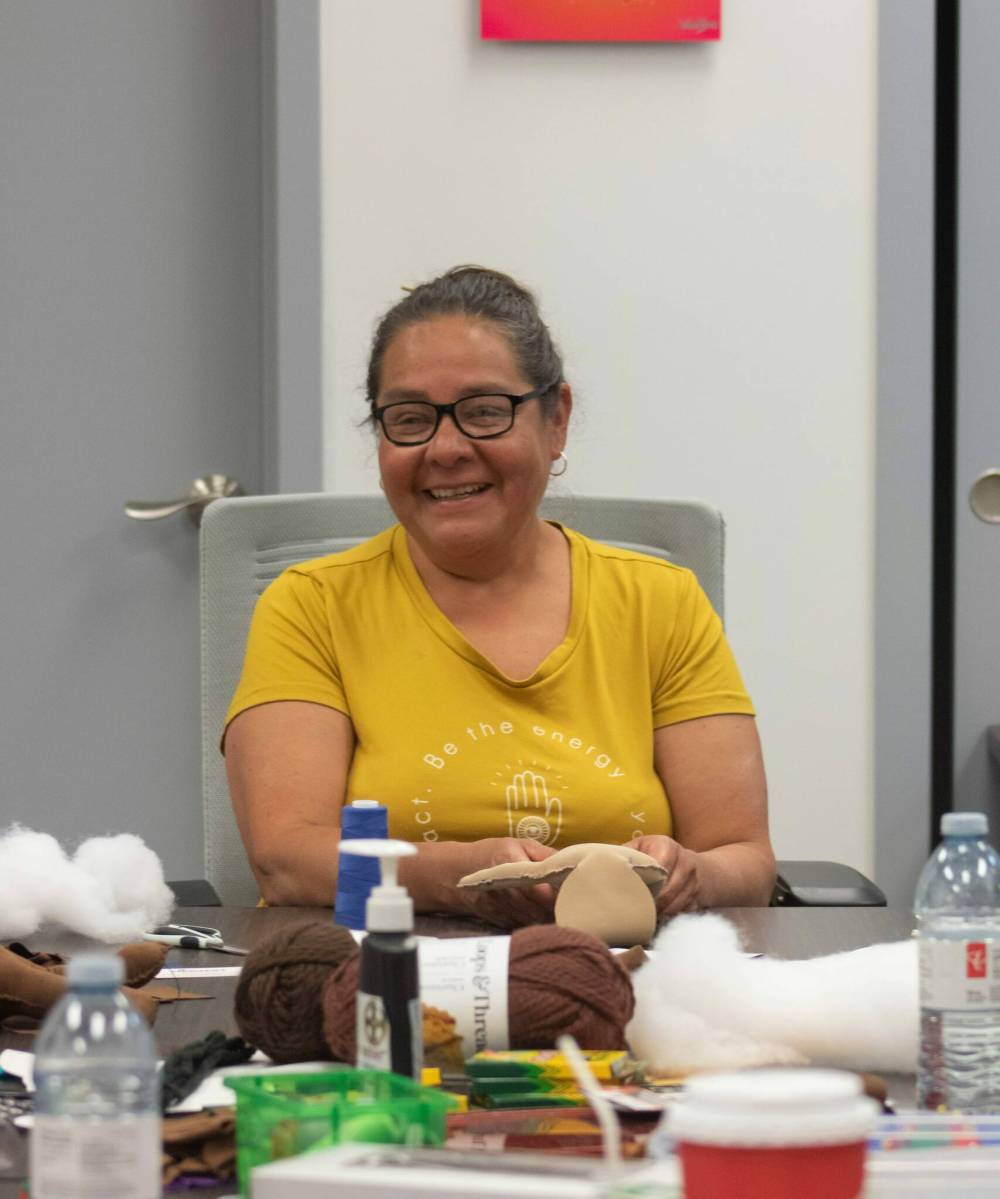 MIKE THIESSEN / WINNIPEG FREE PRESS
                                Diane Maytwayashing facilitates a medicine doll making workshop put on by the Southern Chiefs’ Organization (SCO) Survivors’ Healing Program on Friday. The workshop was designed to bring comfort and healing to survivors of residential schools, day schools, the Sixties Scoop, and anyone experiencing trauma.