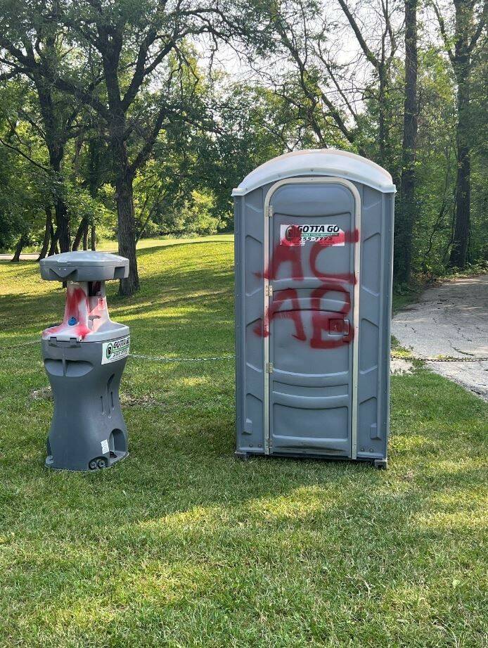 WINNIPEG POLICE HANDOUT
                                Police said more than 65 phrases, including “ACAB,” an acronym used by police abolitionist groups, were spray painted on the roadway, walking paths and portable bathroom stalls.