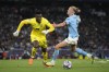 Manchester City's Erling Haaland is challenged by Inter Milan's goalkeeper Andre Onana during the Champions League final soccer match between Manchester City and Inter Milan at the Ataturk Olympic Stadium in Istanbul, Turkey, Saturday, June 10, 2023. (AP Photo/Emrah Gurel)