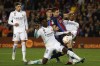 FILE - Barcelona's Robert Lewandowski, center, is challenged by Real Madrid's Eduardo Camavinga, left, and Real Madrid's David Alaba during the Spanish Copa del Rey semifinal, second leg soccer match between Barcelona and Real Madrid at the Camp Nou stadium in Barcelona, Spain, Wednesday, April 5, 2023. Barcelona will open its Spanish league title defense at Getafe when the competition returns to action in mid-August. Real Madrid will visit Barcelona’s Olympic Stadium on the weekend of Oct. 28-29 in the first classic played away from Camp Nou while Europe’s largest soccer stadium undergoes renovations. (AP Photo/Joan Monfort, File)
