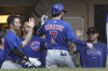 Chicago Cubs' Dansby Swanson is congratulated after hitting a home run during the third inning of a baseball game against the Milwaukee Brewers Tuesday, July 4, 2023, in Milwaukee. (AP Photo/Morry Gash)
