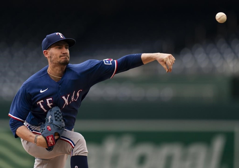 Texas Rangers starting pitcher Andrew Heaney delivers during the third inning of a baseball game against the Washington Nationals, Saturday, July 8, 2023, in Washington. (AP Photo/Stephanie Scarbrough)