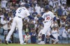 Los Angeles Dodgers' Mookie Betts (50), right, celebrates after his solo home run with Freddie Freeman (5) during the first inning of a baseball game against the Los Angeles Angels in Los Angeles, Saturday, July 8, 2023. (AP Photo/Kyusung Gong)