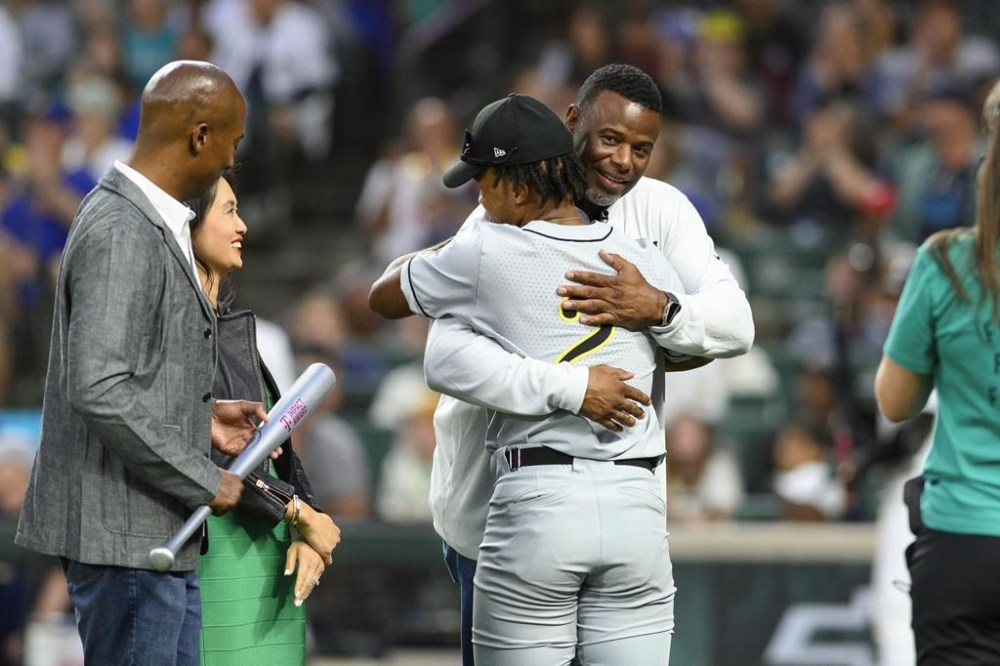 Major League Baseball Hall of Fame player Ken Griffey Jr. embraces Alcorn State University's Kewan Braziel during the HBCU Swingman Classic baseball game during All-Star Week, Friday, July 7, 2023, in Seattle. (AP Photo/Caean Couto)