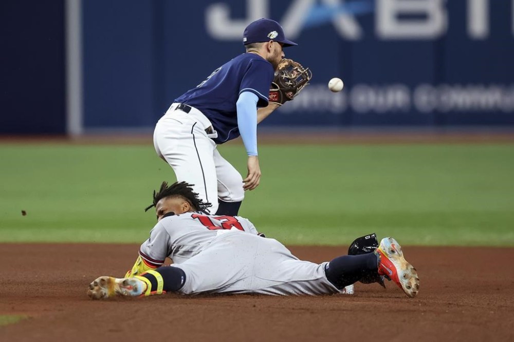 Atlanta Braves' Ronald Acuna Jr. arrives at second with a double as Tampa Bay Rays second baseman Brandon Lowe waits for a late throw during the fourth inning of a baseball game Saturday, July 8, 2023, in St. Petersburg, Fla. (AP Photo/Mike Carlson)