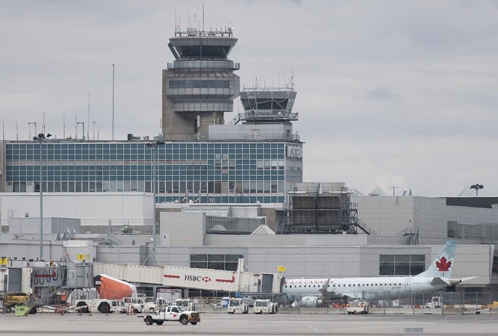 Air Canada planes are shown on the tarmac at Montreal-Pierre Elliott Trudeau International Airport, Saturday, May 16, 2020. THE CANADIAN PRESS/Graham Hughes